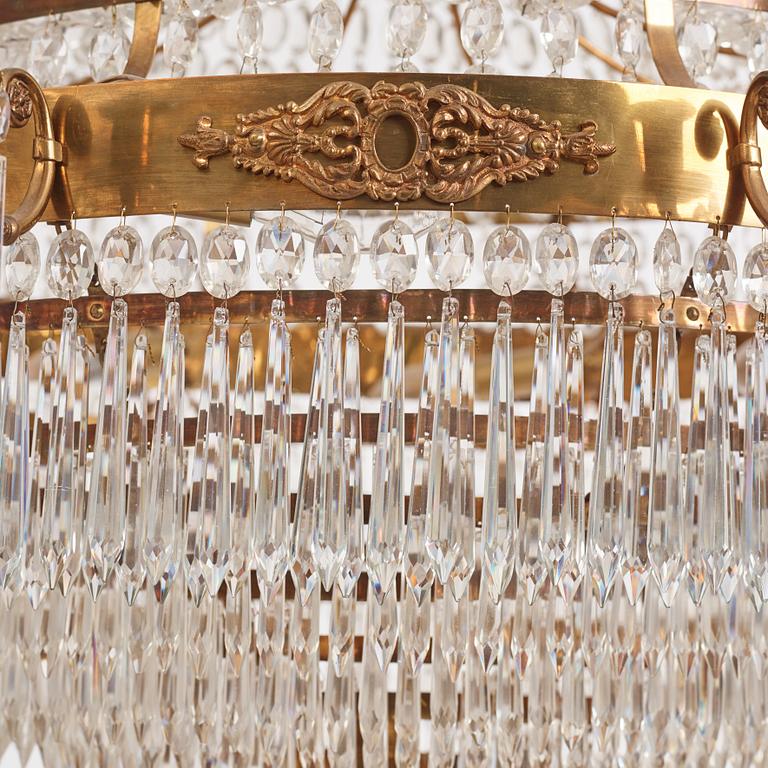 A gilt brass and cut glass nine-light Empire chandelier, first part of the 19th Century.