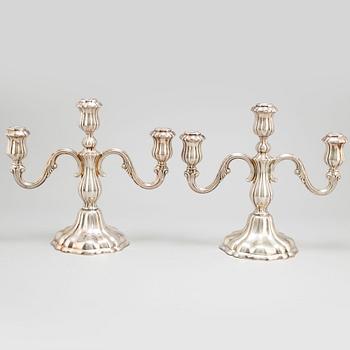 a pair of silver candelabras by K Andersson Gothenburg 1938.