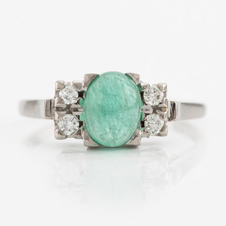 Ring, 18K white gold with cabochon-cut emerald and brilliant-cut diamonds.