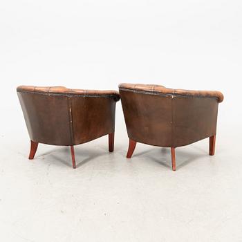 A pair of leather armchairs. second half of the 20th century.