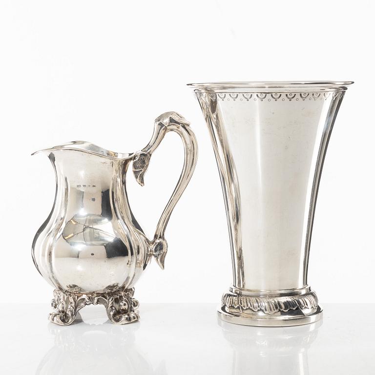 A Swedish silver beaker and a jug, including CG Hallberg, Stockholm 1927.