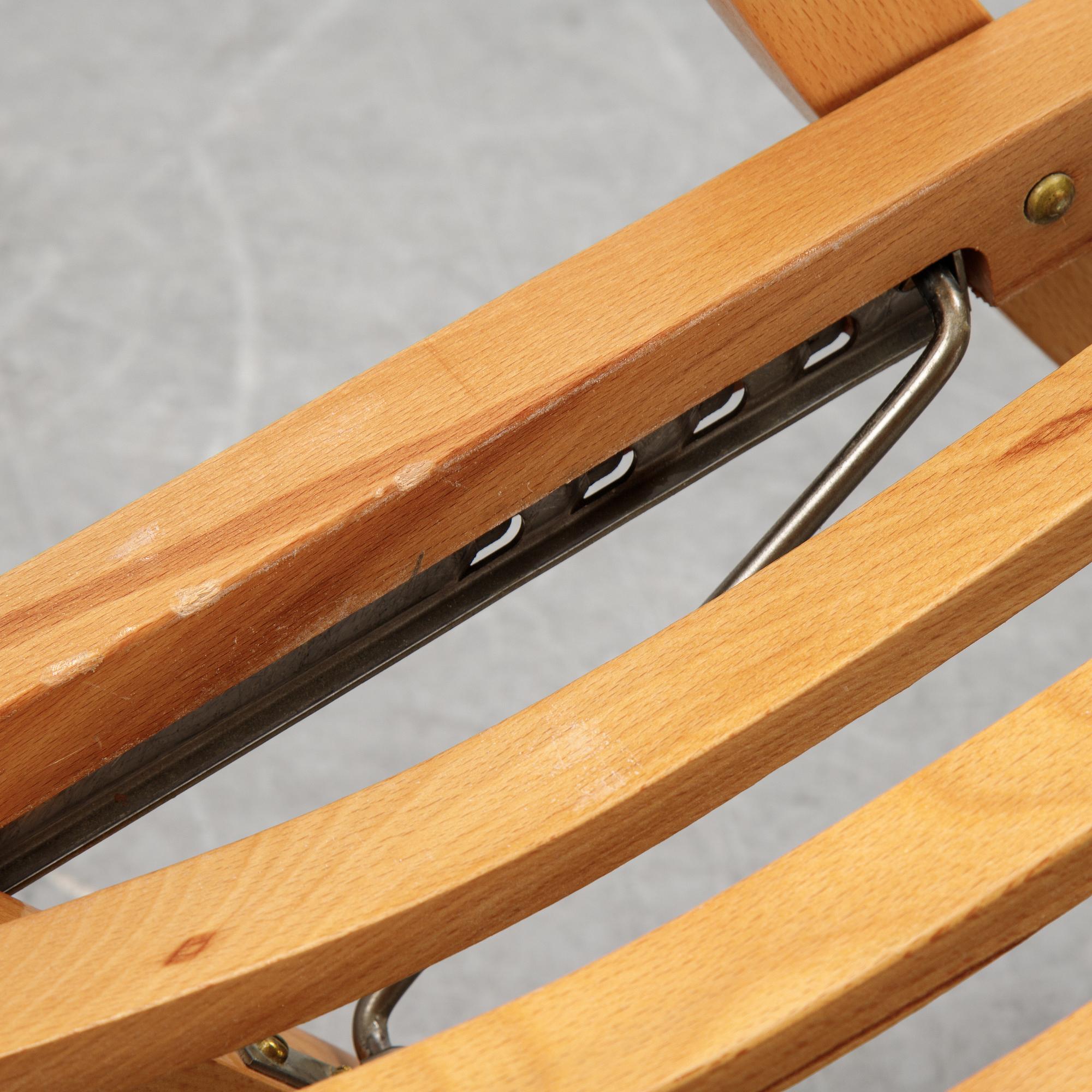A pair of elm wood lounge chairs, Brogrens, second half of the 20th Century.