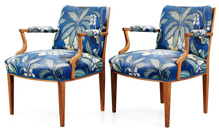 A pair of Josef Frank mahogany and ratten armchairs, Svenskt Tenn,