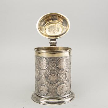 A German 18th century parcel-gilt silver coin-tankard, mark of Johann Friedrich Beyer, Schweidnitz (1736-1775).