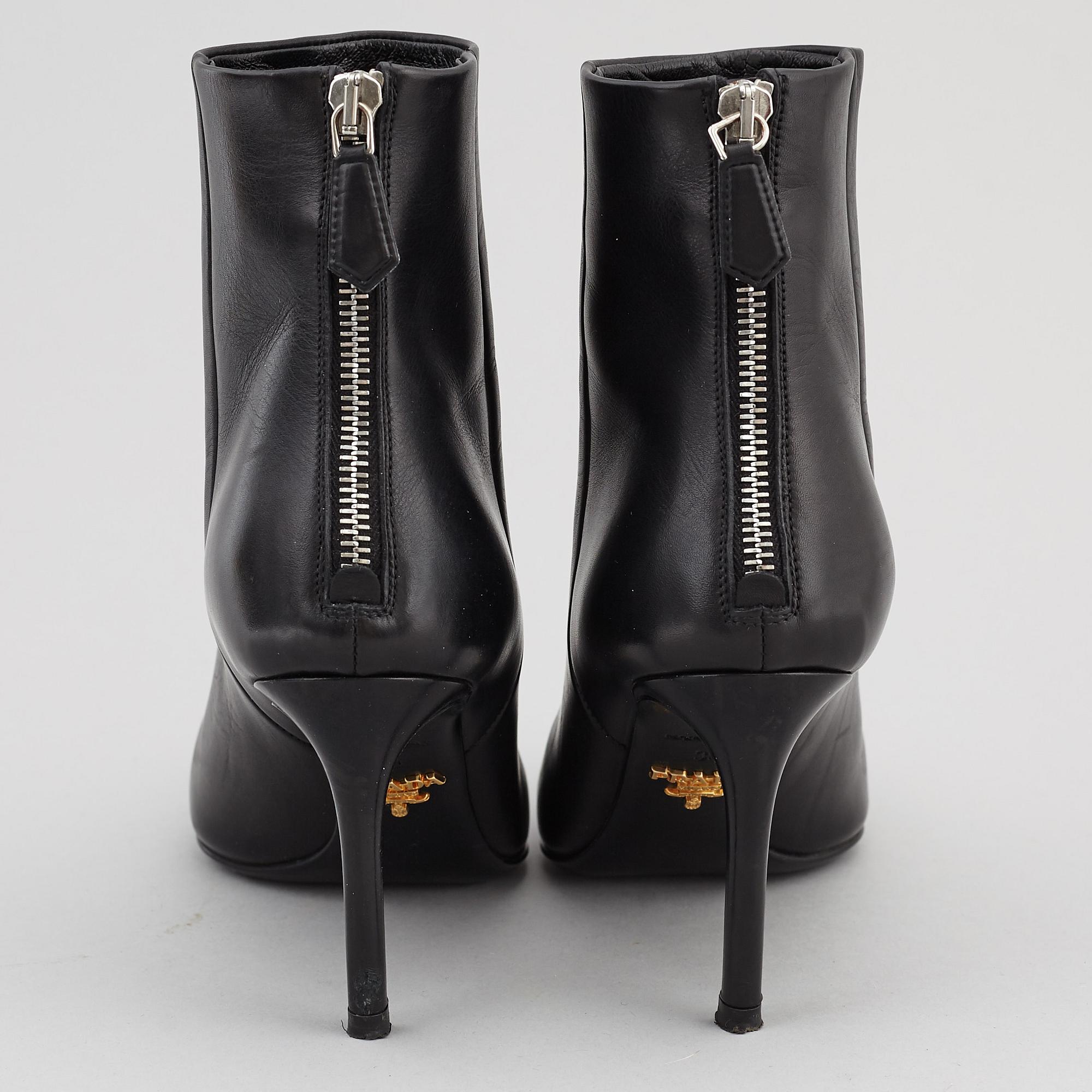 PRADA, a pair of black leather boots, size 35.