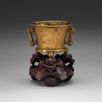 121. A gilt copper alloy tripod censer, Qing dynasty, presumably 18th Century with Xuandes six character mark.