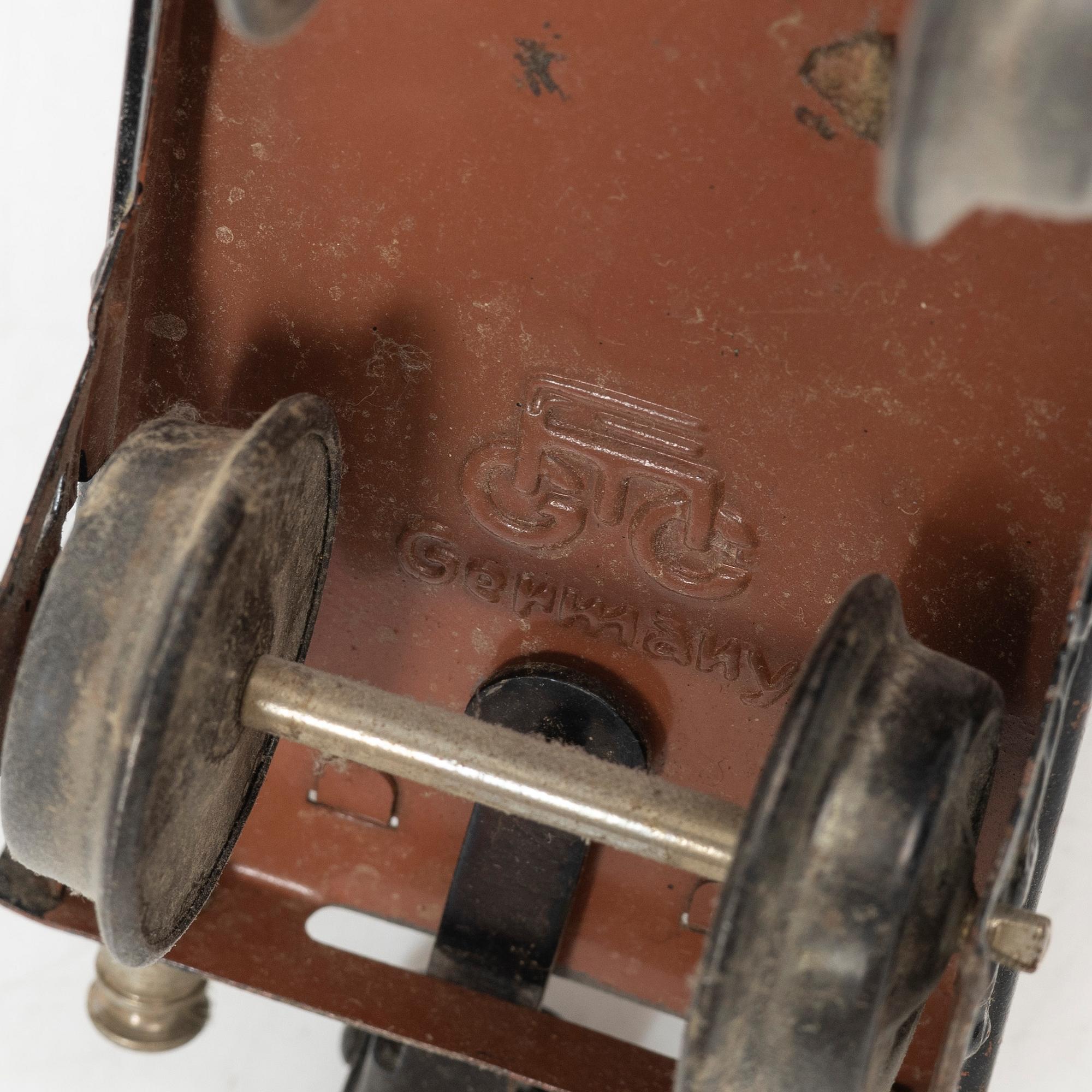 Model train with track and station building, 13 pieces, Germany, 1920s.