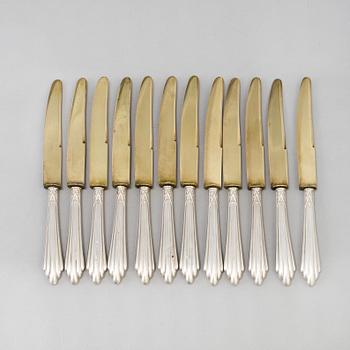 A set of twelve parcel-gilt silver fruite knives from the late 19th century.