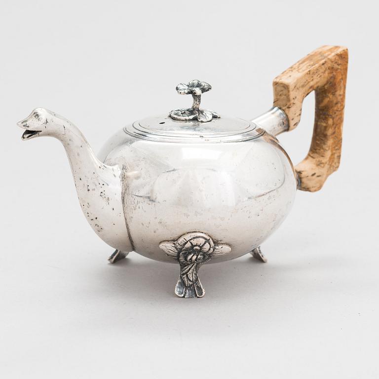 A late 18th-century silver teapot with a Karelian birch handle, Saint Petersburg 1791. Assay master Nikifor Moshchalkin.