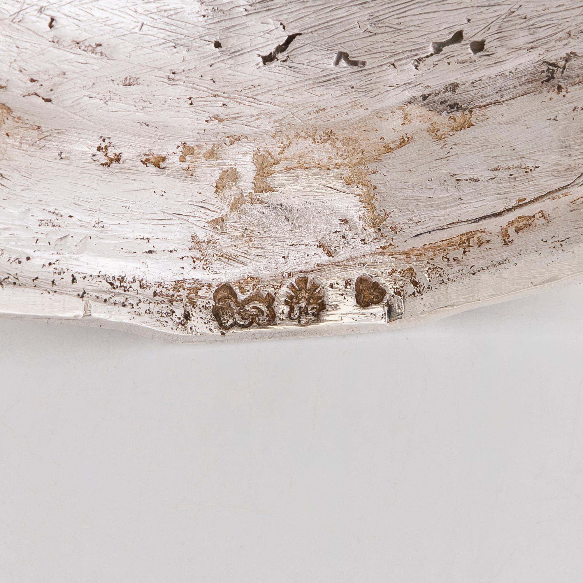 A pair of 18th-Centuty French silver candlesticks, maker's mark of Jean-Joseph Falguière (active in Dinan 1744-1773).