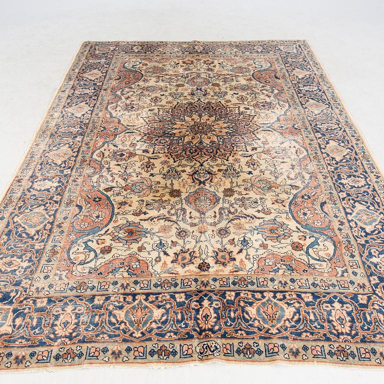 An antique Tabris carpet approx 304x212cm.