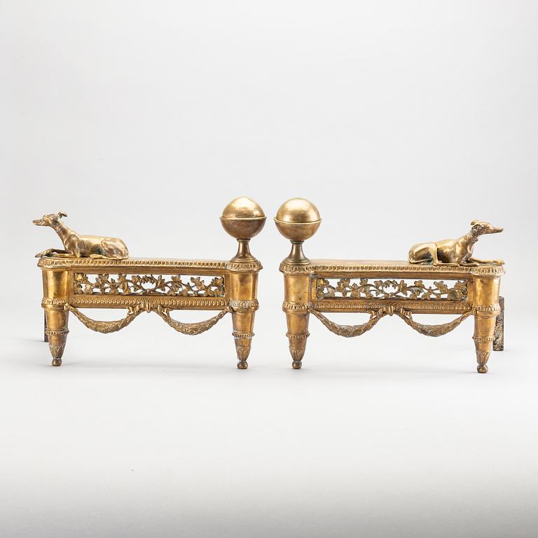 A pair of Louis XVI 18/19 century fire dogs.