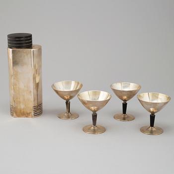 A silver plated and bakelite shaker and four glasses, mid 20th century.