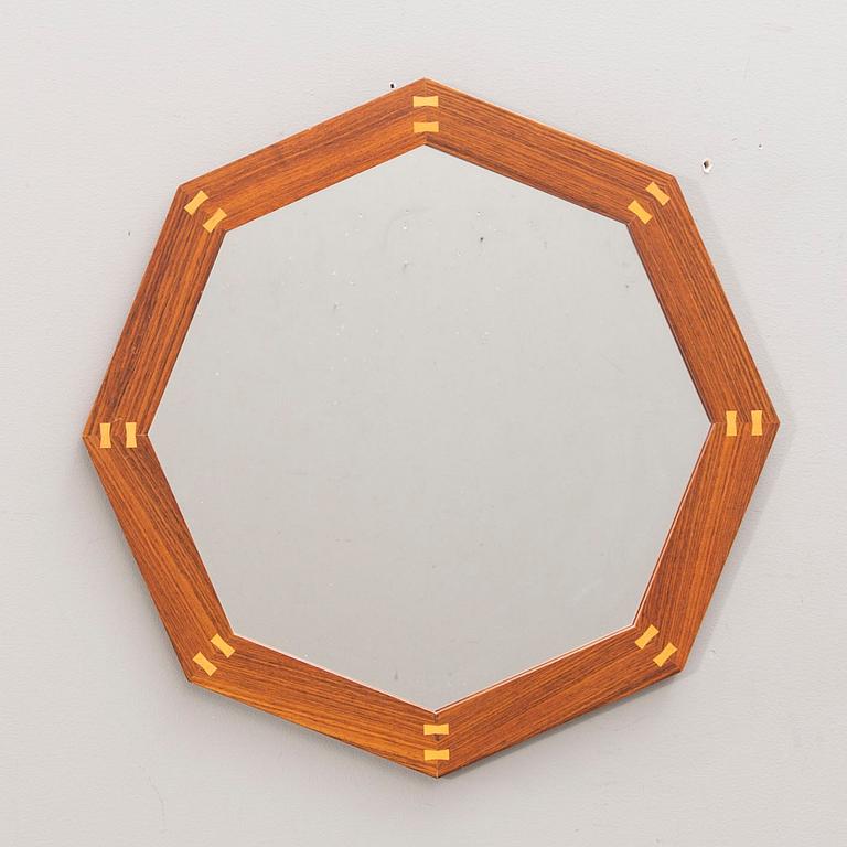 A Sigvard Bernadotte jacaranda mirror for Aktuell Form later part of the 20th century.