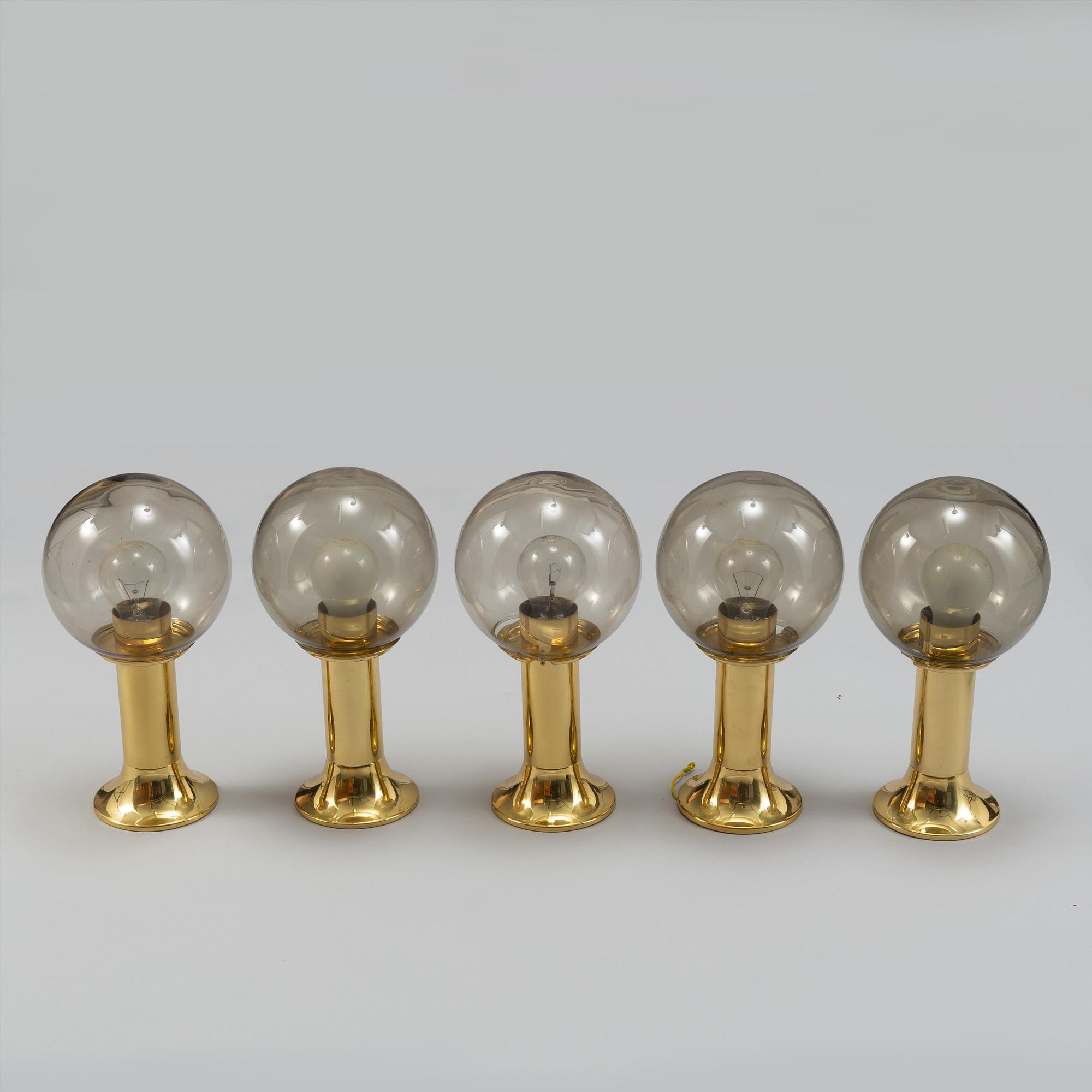 Five 1970's brass and glass ceiling/table lamps, Ott international.