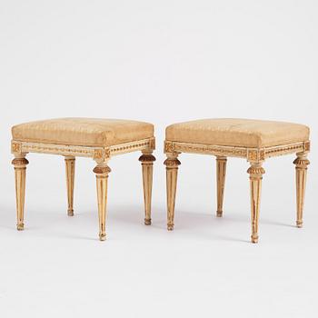 A pair of late Gustavian carved and giltwood stools by M. Lundberg the Elder (master 1775-1812).