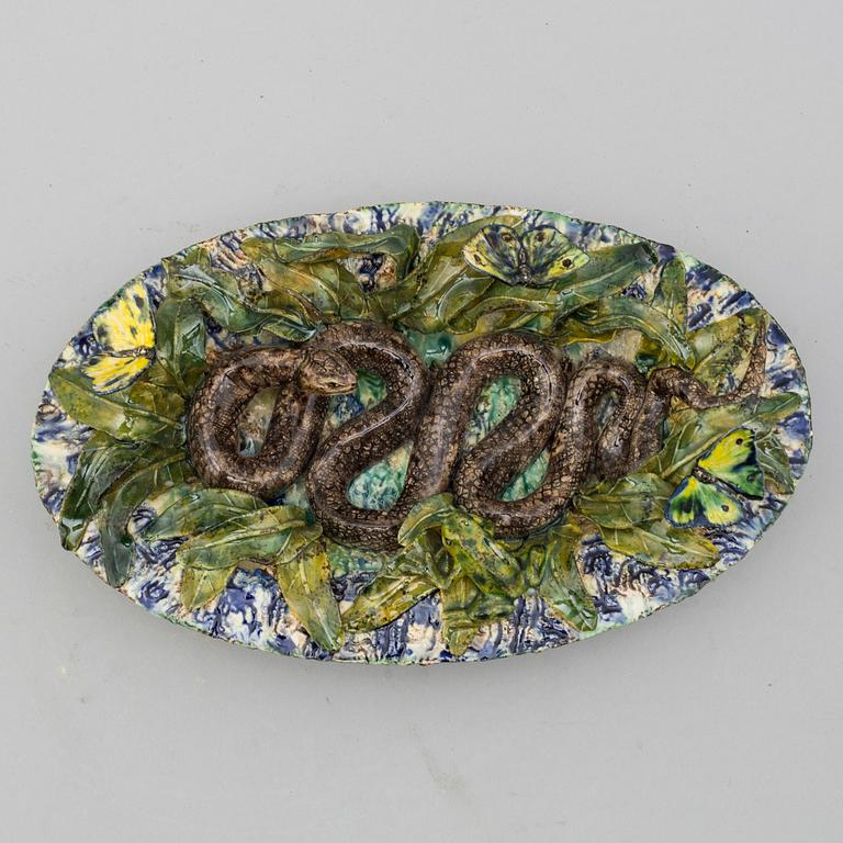 A richly decorated Palissy-style majolica plate, 19th century.