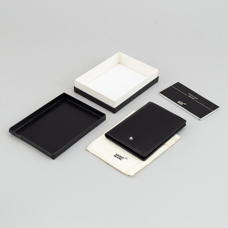 MOntblanc, a ball point pen and leather passport holder.