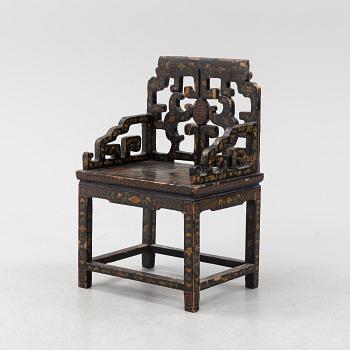 A Chinese lacquered chair, 20th Century.