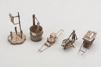 A set of five Chinese silver figurines.