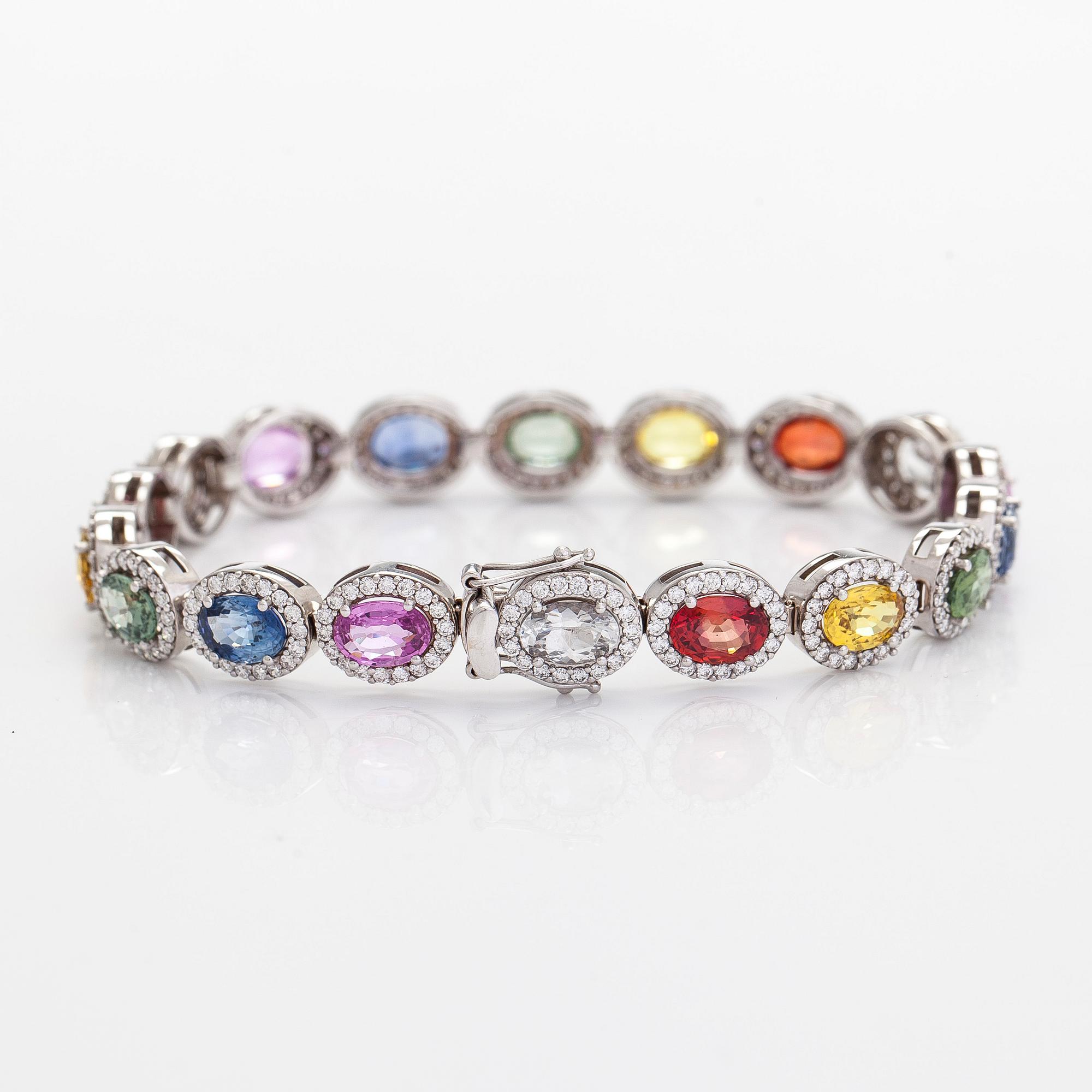 A multi-colour sapphire and diamond bracelet in 14K whitegold.