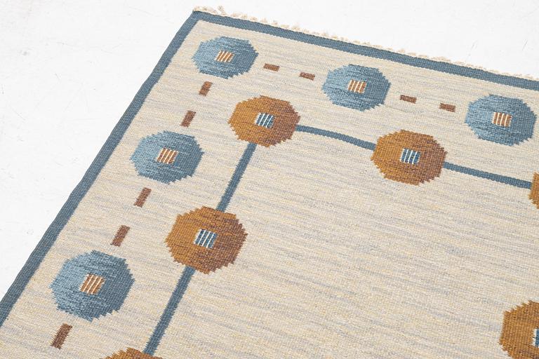 A flat weave carpet by Anna-Greta Sjöqvist c 223 x 144 cm, signed AGS.