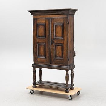 A Baroque style cabinet on later stand, first part of the 18th Century.