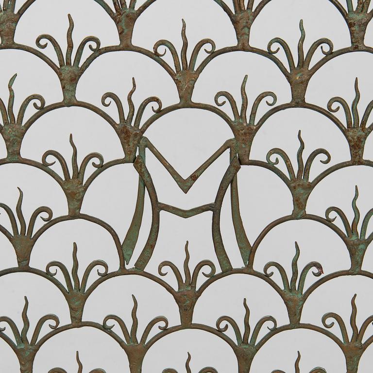 A radiator cover, metalwork, likely Taidetakomo Hakkarainen, 1930s.