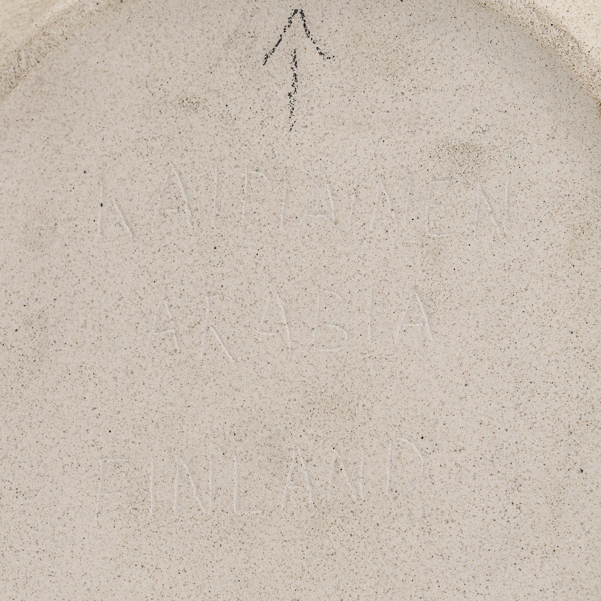 Birger Kaipiainen, a decorative stoneware plate signed Kaipiainen Arabia Finland.