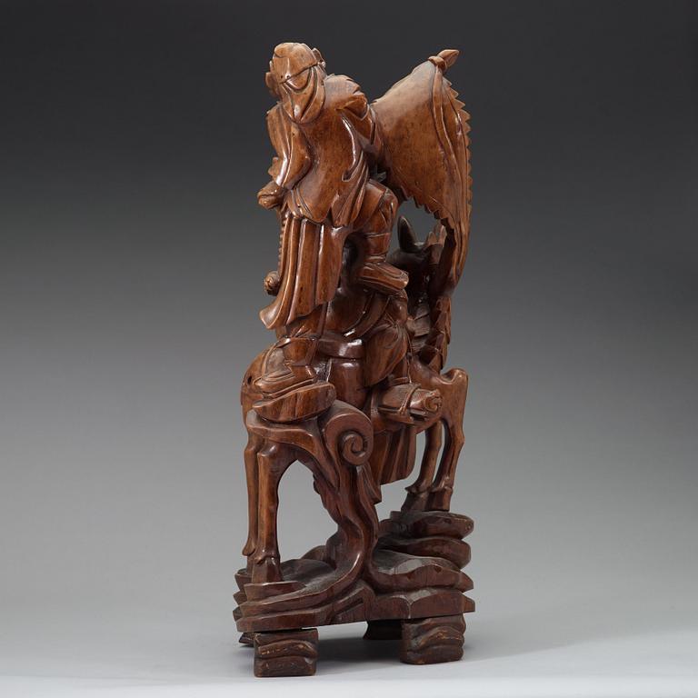 A large wooden sculpture group of Guandi on horseback and an attendant, Qing dynasty (1644-1912).