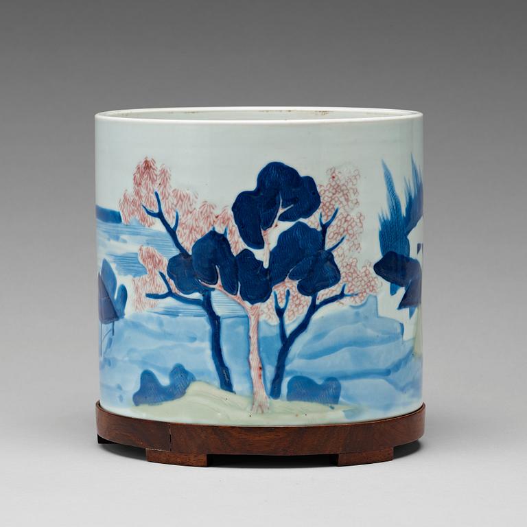 An underglaze blue, copper-red and celadon-glazed brushpot, Qing dynasty, early 18th Century, with Chenghuas mark.