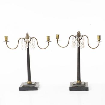 A pair of wooden candelabras, around 1900.