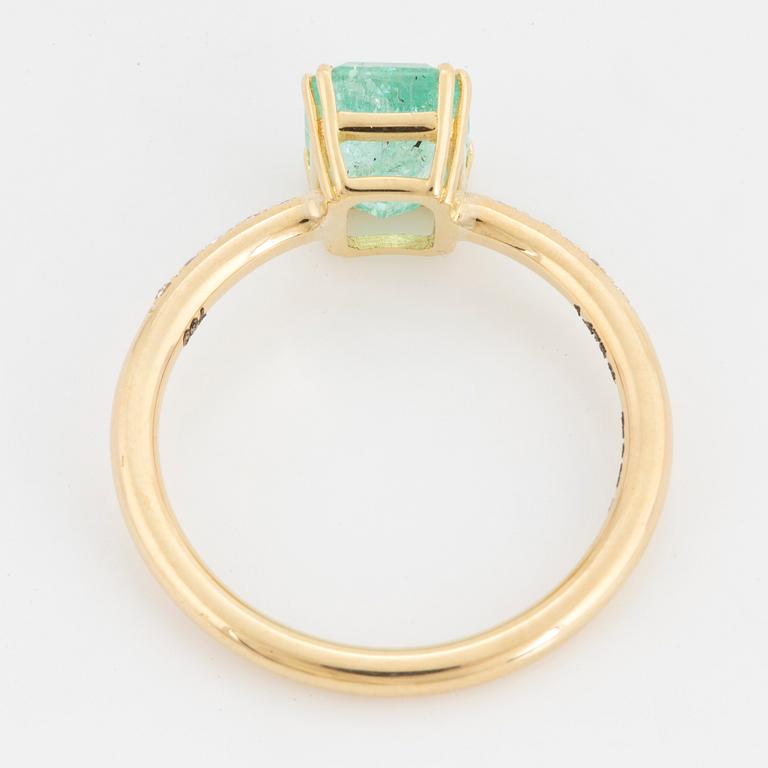 Emerald-cut  pale emerald and brilliant-cut diamond ring.