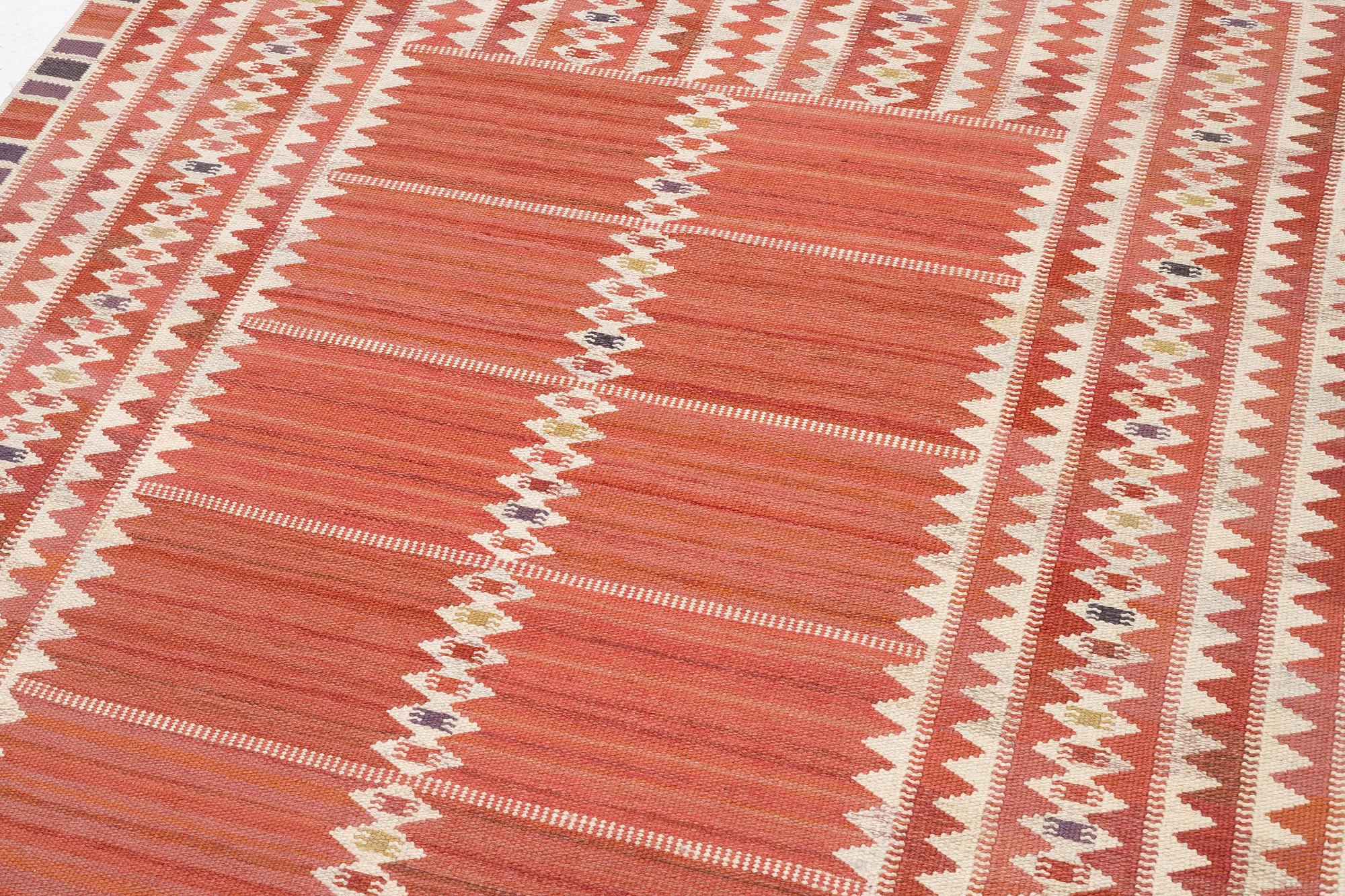Barbro Nilsson, a carpet, 'Salerno röd', flat weave, c. 261 x 193 cm, signed AB MMF BN.