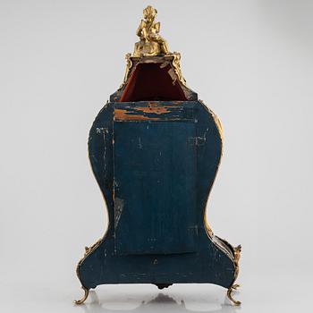 Clock, Rococo style with partially older parts, around the year 1900.