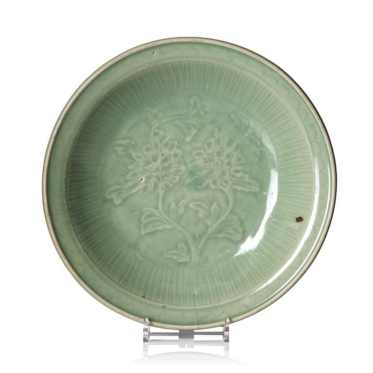 A large celadon glazed dish, Ming dynasty (1368-1644) or later.