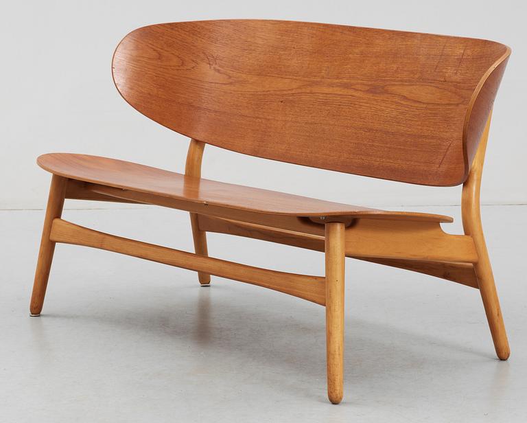 A Hans J Wegner teak and beech 'Shell' settee by Fritz Hansen, Denmark, 1950's.