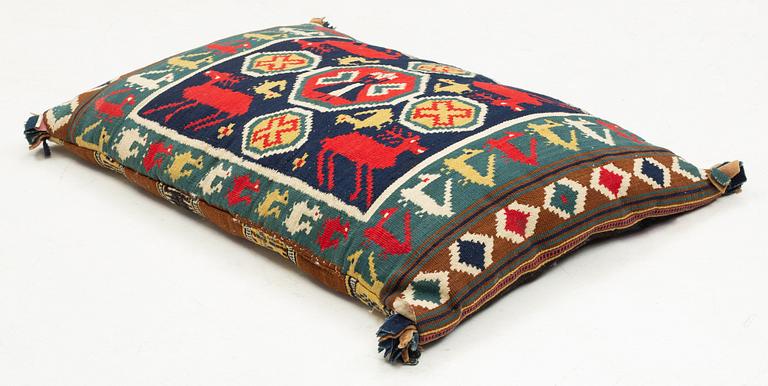 A double-interlocked tapestry carrige cushion from the first half of the 19th century, ca 85 x 55 cm, Scania, Sweden.