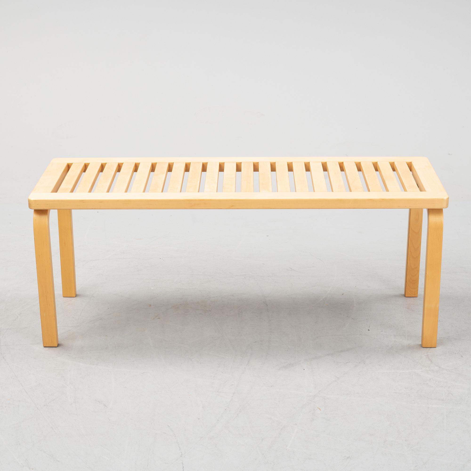 A bench and a stool by Alvar Aalto, from around the year 2000.