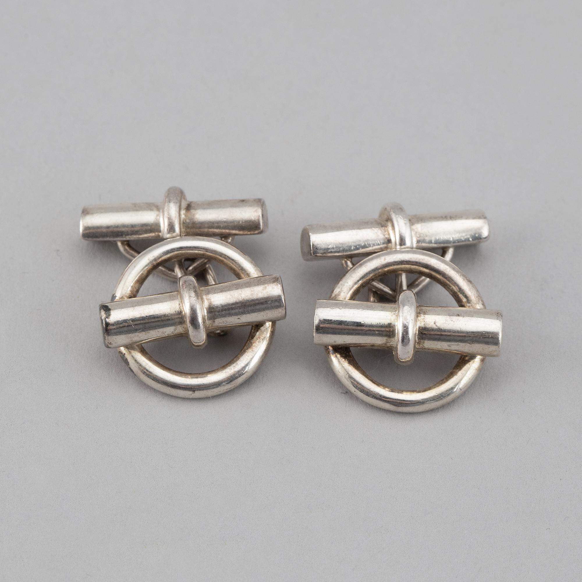 HERMÈS, a pair of silver cuff links.