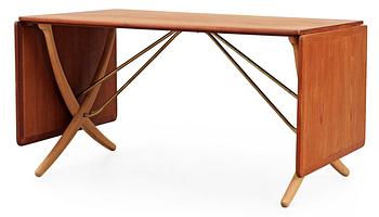 A Hans J Wegner teak and beech dinner table by Andreas Tuck, Denmark.