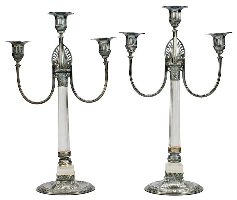A pair of white metal three lights candelabra, Orivit, Germany, early 20th Century.