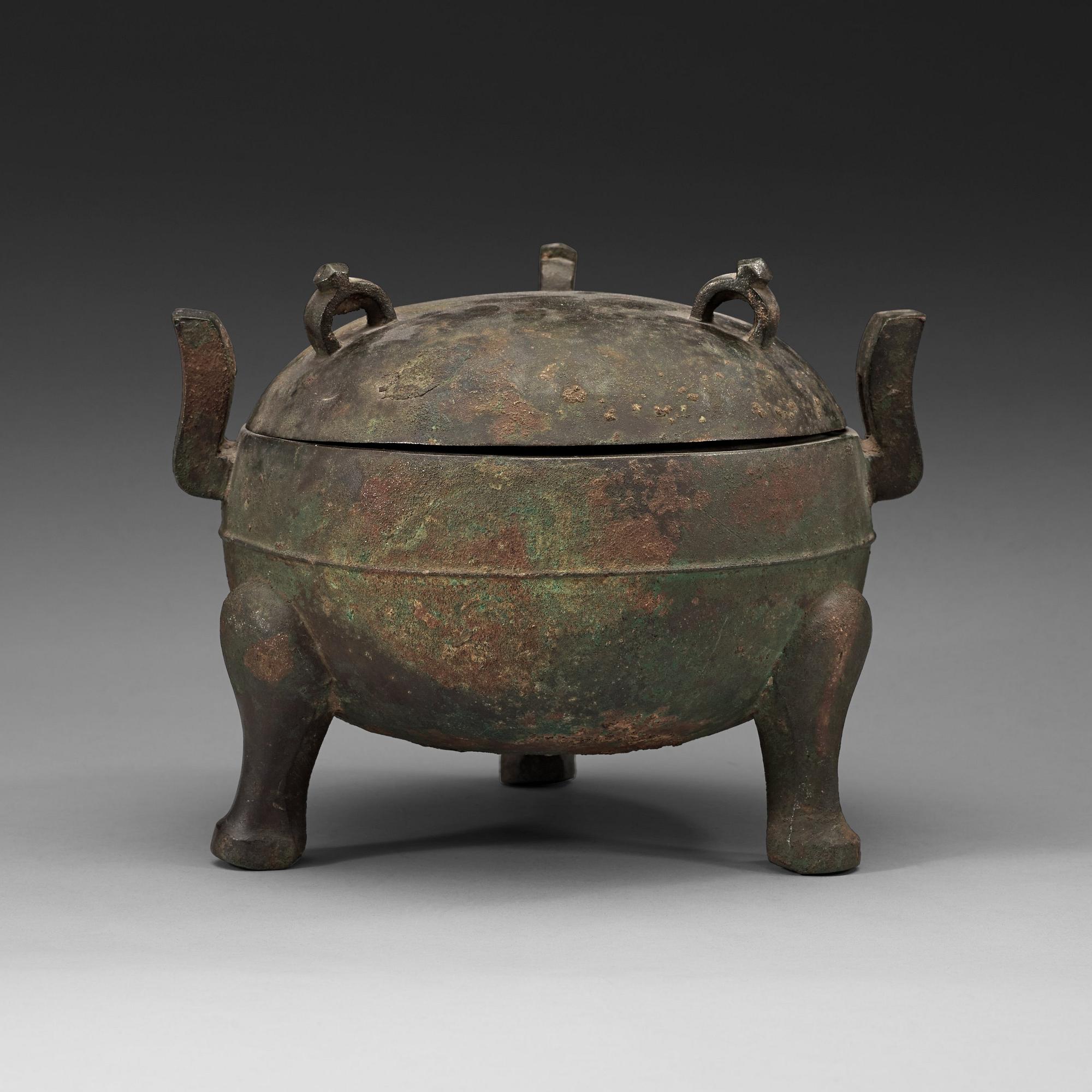 A bronze ding tripod censer with cover, presumably Han dynasty (206 BC - 220 AD).
