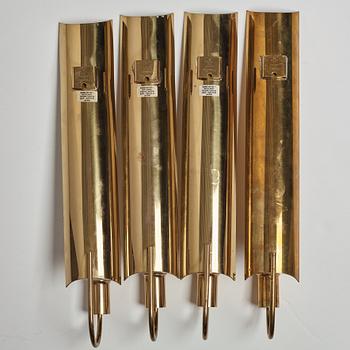 A set of four 'Reflex' brass wall scones by Pierre Forsell, Skultuna.