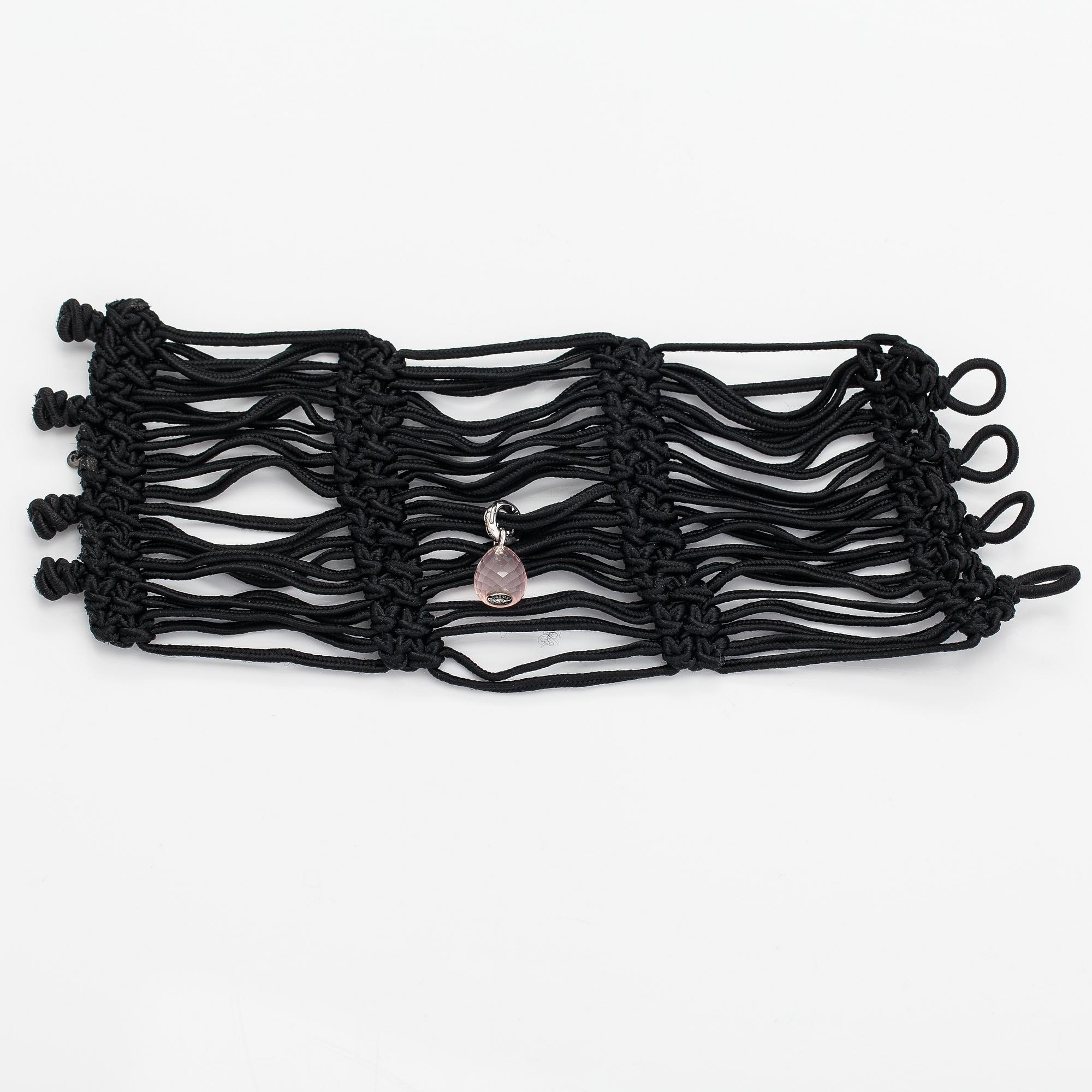 Ole Lynggaard, A satin like band bracelet with an 18K white gold and rose quartz "Sweet drops" pendant.