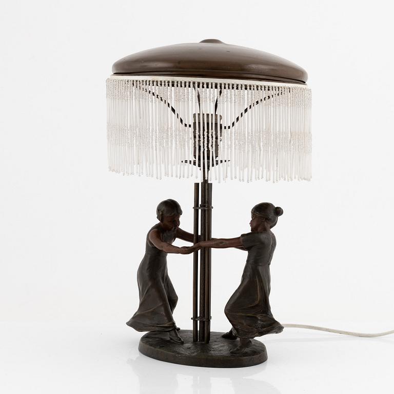 An Art Nouveau bronze table light, early 20th Century.