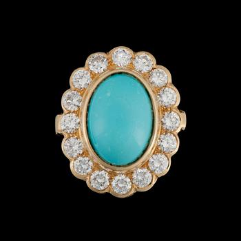 1072. A cabochon cut turquoise ring with brilliant cut diamonds, tot. ca 1.90 ct.