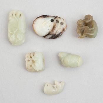 A group of nine Chinese stone figures, some of them nefrite, late Qing dynasty/20th century.