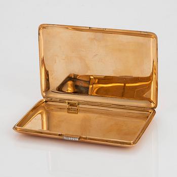 A WA Bolin cigarette case in 14K gold set with eight-cut diamonds.