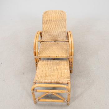 A mid 1900s rattan and bamboo garden chair.
